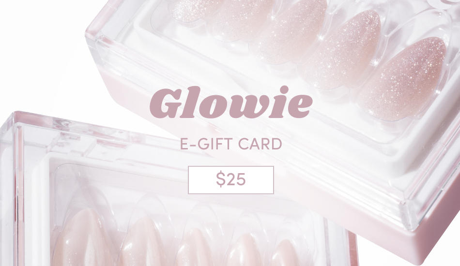 Image of a $25 Glowie Co. Gift Card showcasing salon-inspired designs accompanied by two boxes of shiny, light pink press-on nails in assorted sizes against a white, minimalistic background.