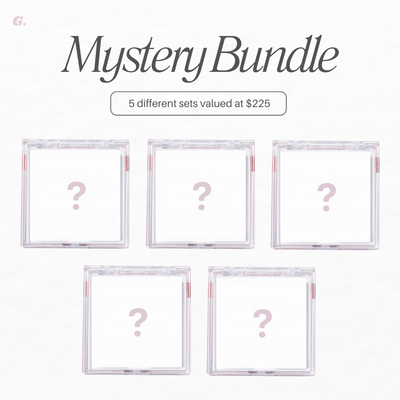 An image for Glowie By Her's "Mystery Bundle 2" promotion features five translucent boxes with question marks. Text reads "5 different sets valued at $225," suggesting surprise items worth over $115 each on a crisp white background.