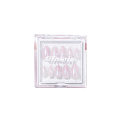 A clear plastic box containing a set of ten pink, glossy, oval-shaped press-on nails is centered on a white background. "Glowie By Her." is printed on the box in white text. These limited edition, salon-quality 777 Press-On Nails offer a touch of elegance for any occasion.