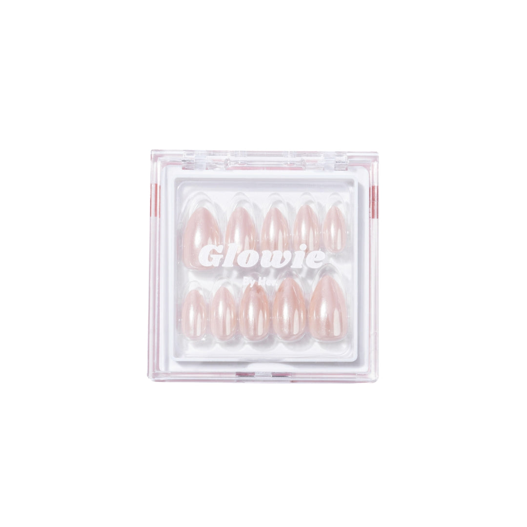 A square plastic case from Glowie By Her, branded "Allure Press-On Nails," containing ten salon-quality nude-pink press-on nails. The nails are arranged in two rows and vary in size, with the word "Glowie" printed in white on the case's transparent lid.