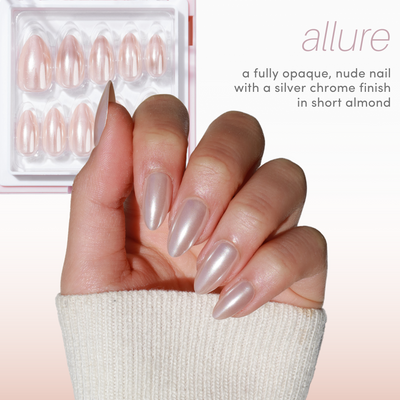 A hand with short almond-shaped nails shines in a nude silver chrome finish. The Chrome Crush (10% Off) box from Glowie By Her is seen in the background. Text reads: "allure - fully opaque, nude nail with a silver chrome finish in short almond.