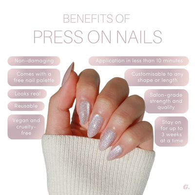 A hand adorned with Skye Press-On Nails from Glowie By Her sparkles against a white background. Text surrounding the hand highlights the benefits of Skye Press-On Nails, including being non-damaging, quick to apply, 100% customizable, salon-quality nails that are long-lasting, reusable, and vegan and cruelty-free.