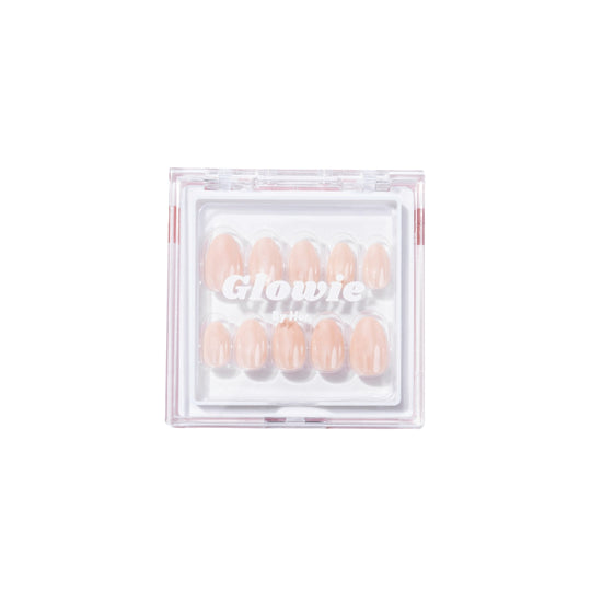 A set of salon-quality artificial nails in a clear square packaging with a white background. The soft pink nails, echoing the style of "Bubbly," are arranged in two rows. The packaging prominently features the text "Glowie By Her" in white.