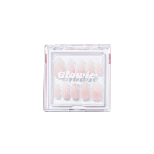 A clear plastic container branded "Glowie By Her" houses a set of Daydream Press-On Nails (Short) in various sizes. The salon-quality, pink short almond style nails are neatly arranged and visible through the lid of the container, ensuring convenience and easy selection.