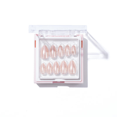 The Allure Press-On Nails by Glowie By Her is a set of fourteen customizable, salon-quality press-on nails, neatly arranged in two rows within a small plastic case. These nails come in varying sizes and feature a glossy, pearlescent light pink finish. The slightly open case casts a shadow on the white surface beneath it.