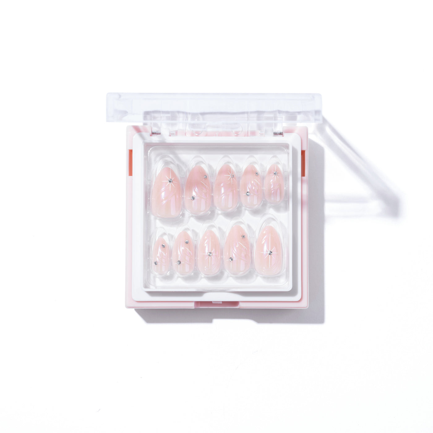 A transparent box contains a set of 12 Aura Press-On Nails in iridescent pink chrome with small star designs. The open hinge lid displays the various sizes of the glossy almond nails neatly arranged inside. Against a white background, this reusable nail kit from Glowie By Her is a chic choice for any occasion.