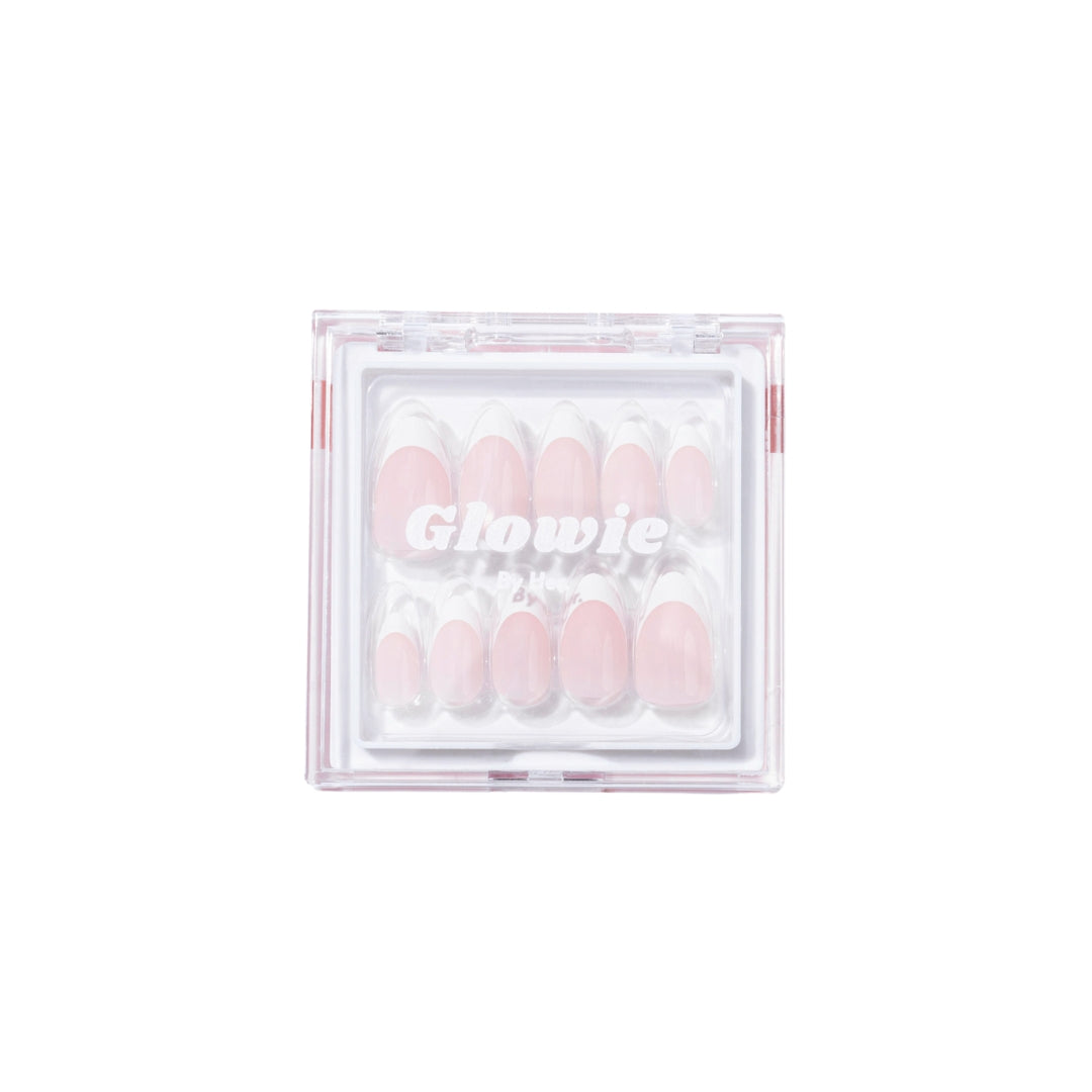 A transparent square box contains ten salon-quality 'That girl' Press-On Nails inside it. The pink nails vary in size and are 100% customizable. The branding on the lid reads "Glowie Co.