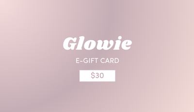 A pink gradient background features "Glowie By Her" in white, with a button displaying "FREE $30 Gift Card (orders $150+ only)". Perfect for Christmas gifting, T&C's apply for purchases $150+.